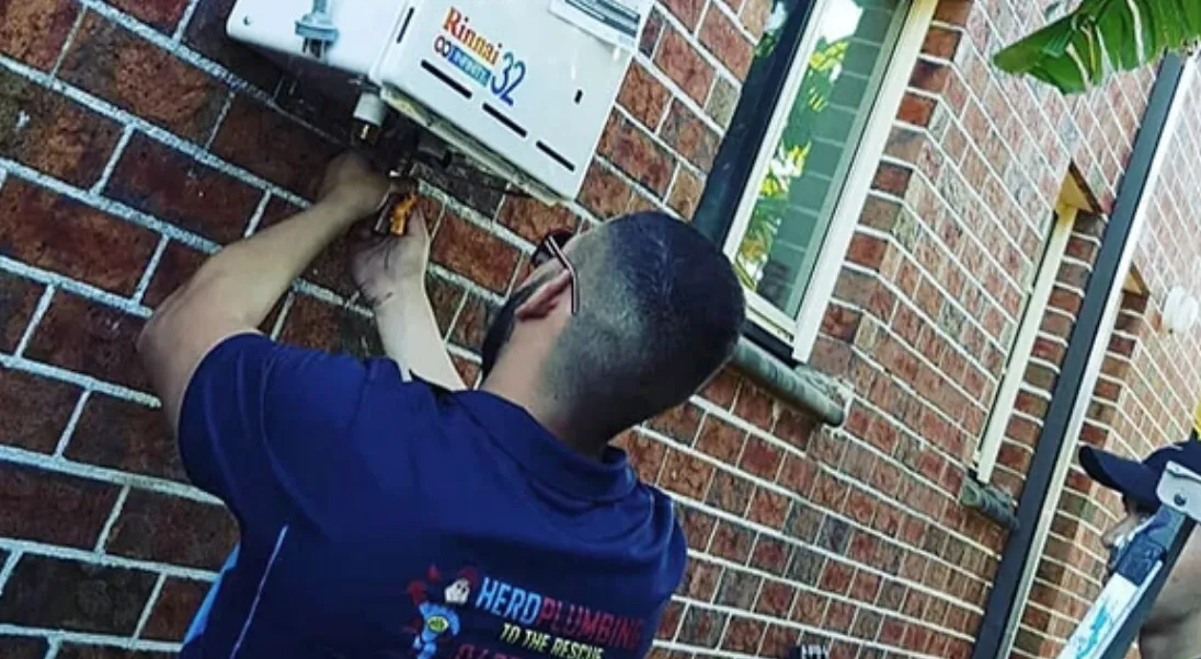 Hero plumbing expert fixing Rinnai Instant Gas Water Heater